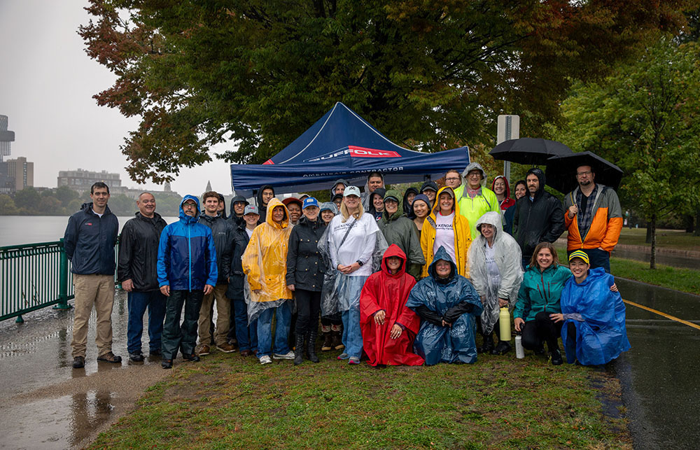 Suffolk employees working on 585 Kendall project help clean up Charles River with Takeda Pharmaceutical